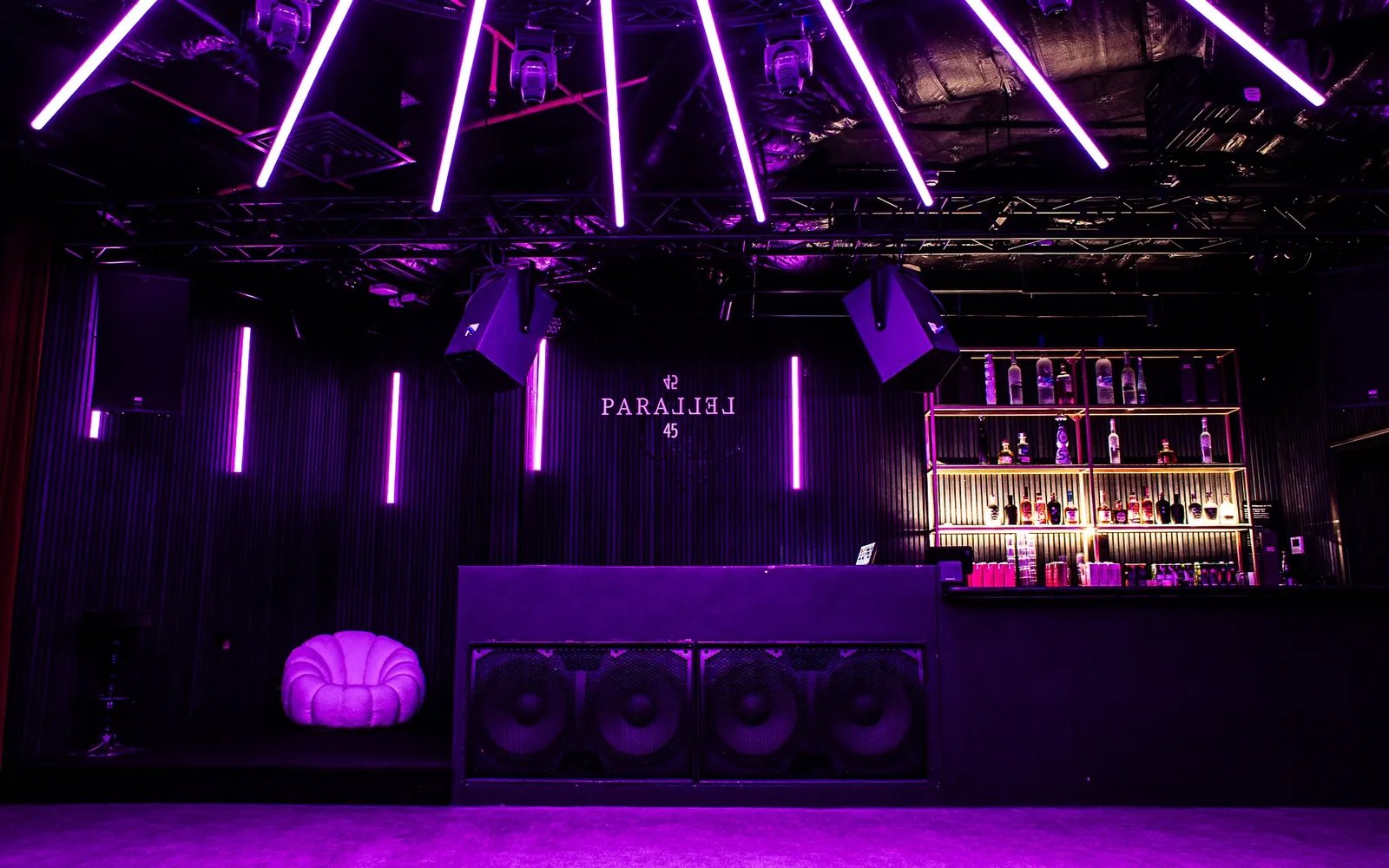 Parallel 45 basement club lit in purple neon